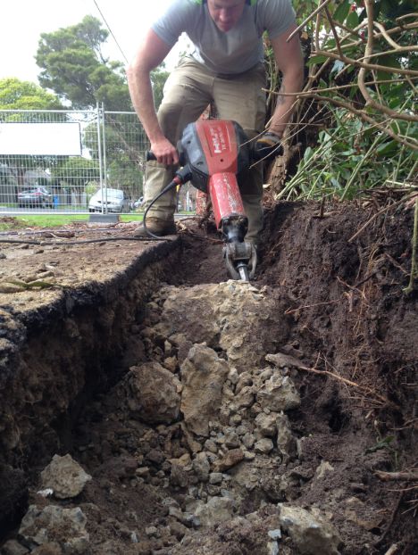 A hilti jack hammer bring used to demolish an old footing in Bayside in order to pour a new footing for a front brick fence