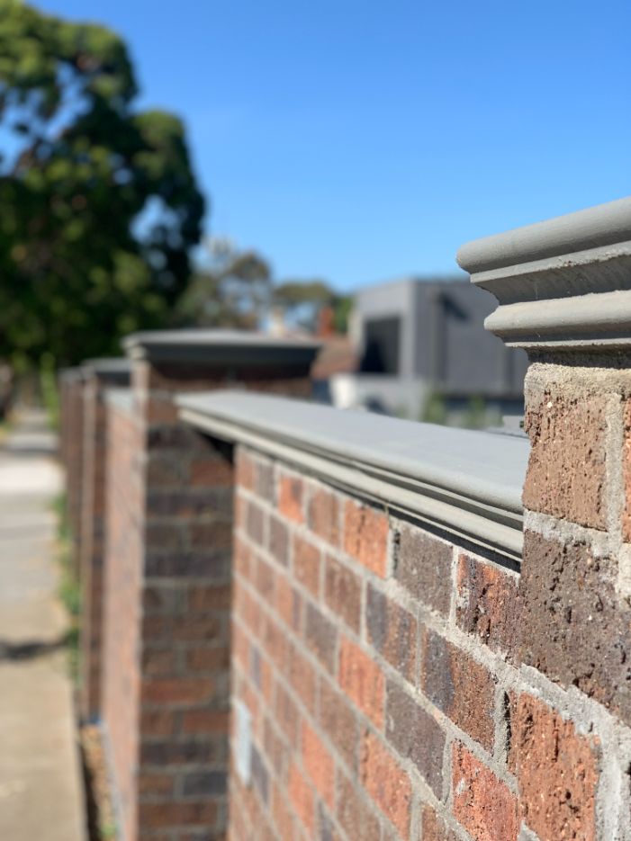 Solid brick fence with pier capping on a front fence Melbourne job by Bayside Brick Fences