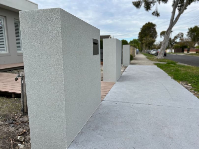 A newly rendered brick fence built by Bayside Brick Fences in Hampton